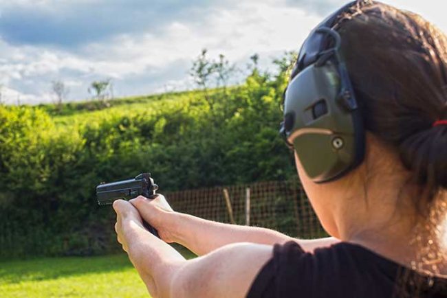 lady firing pistol